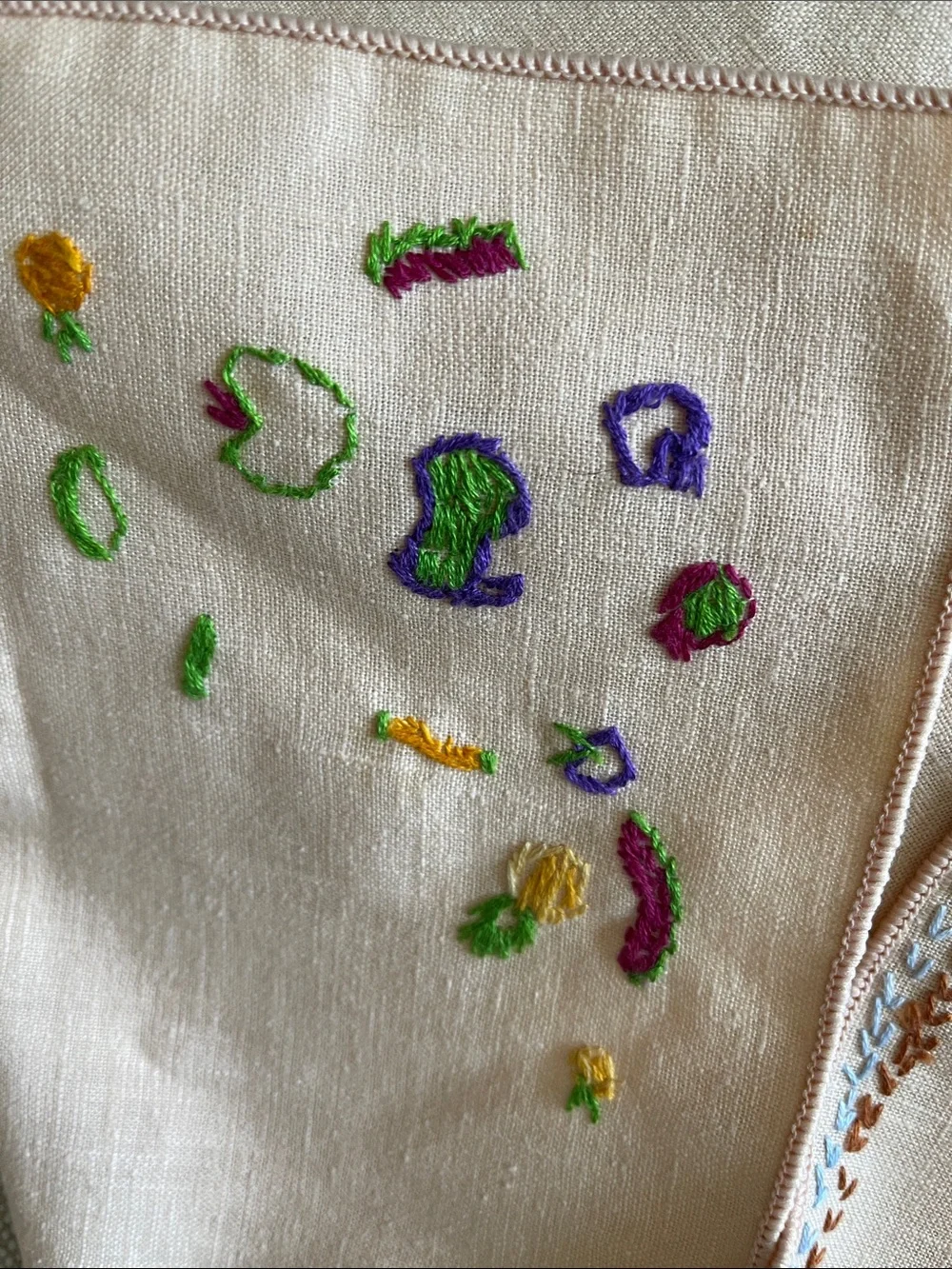 Hand-Embroidered Linen Napkin with Colorful Floral Accents